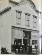 ( Photo: John Lobban-left, and J. M. Alderson-right, and others in from of J. M. Alderson’s General Store. (ca. 1895. Click photo to enlarge)