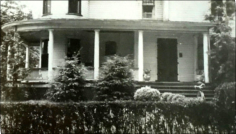 The Russell's home.  Note the hedge in front and bycycle in front of steps.