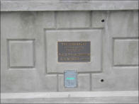 The original plaque for the addition of the sidewalks was save and installed.
